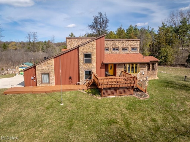 3871 Foskett Rd, Medina, OH 44256 - rear view of property with a deck, stone siding, and a yard