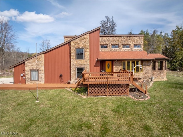 3871 Foskett Rd, Medina, OH 44256 - back of property featuring stone siding, a deck, and a lawn