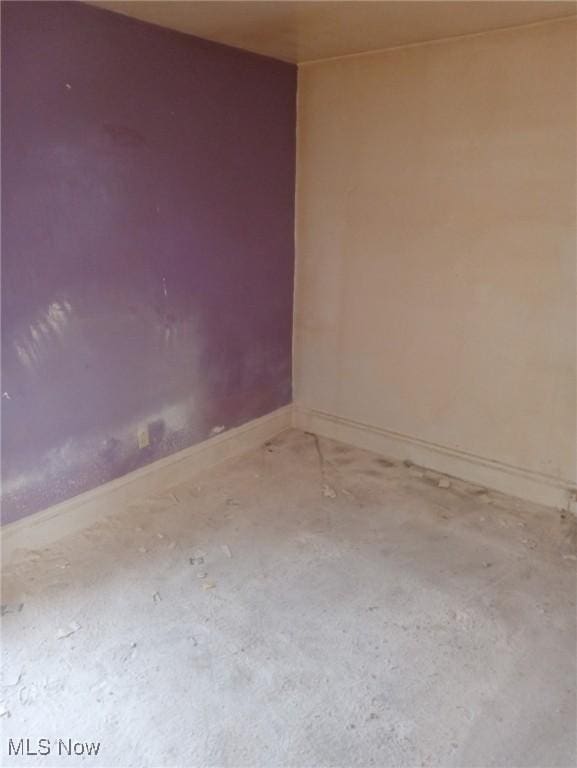 empty room with baseboards