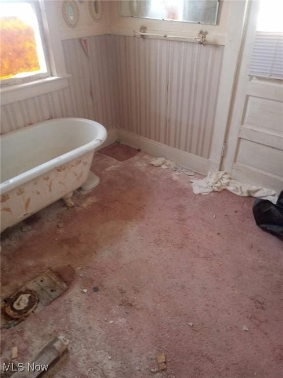 bathroom with a soaking tub