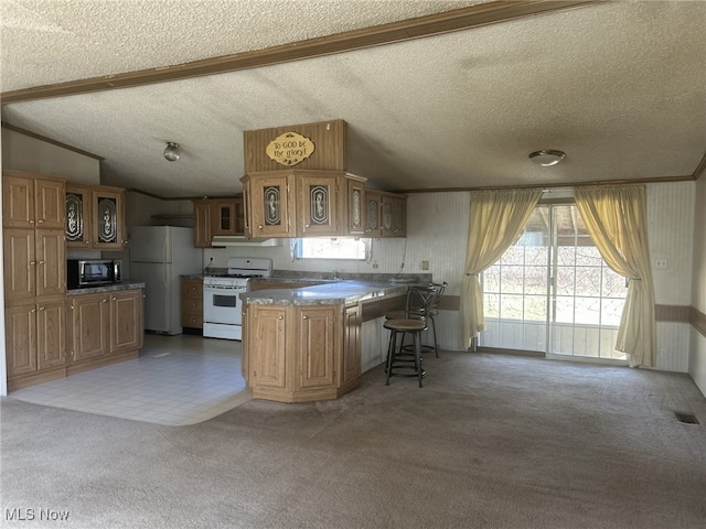 7280 US Route 322, Williamsfield, OH 44093 - kitchen with carpet flooring, a peninsula, glass insert cabinets, lofted ceiling, and white appliances