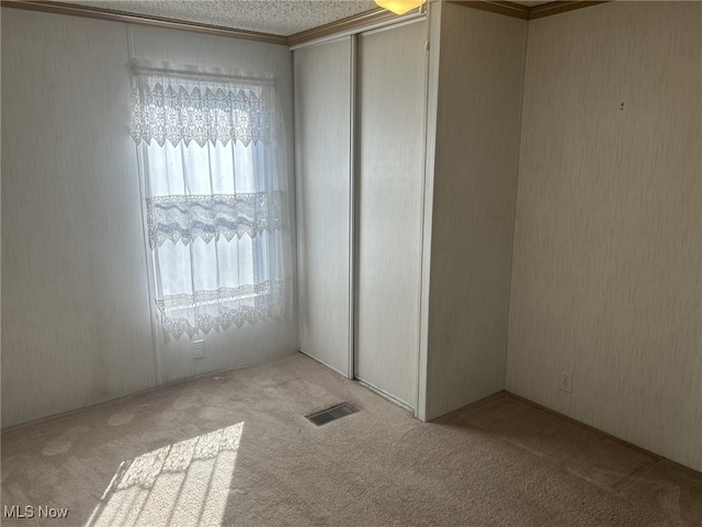 7280 US Route 322, Williamsfield, OH 44093 - unfurnished bedroom with visible vents, a closet, and carpet floors