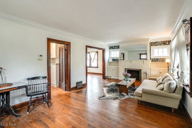 3596 W 155th St, Cleveland, OH 44111 - living area with wood finished floors, crown molding, and a fireplace