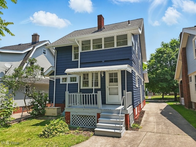 3596 W 155th St, Cleveland, OH 44111 - view of front facade with a porch, a chimney, concrete driveway, and roof with shingles