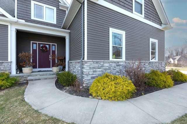 view of exterior entry with stone siding