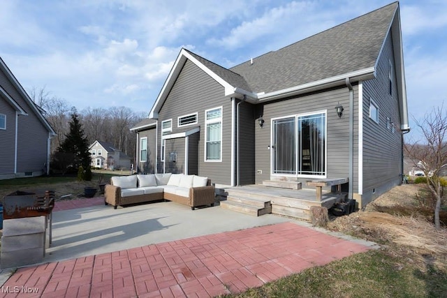 back of house with a patio area, an outdoor living space, a shingled roof, and crawl space