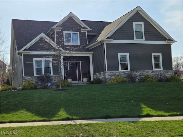 226 Hidden Glen Trl, Chardon, OH 44024 - craftsman house with stone siding, a front yard, and roof with shingles