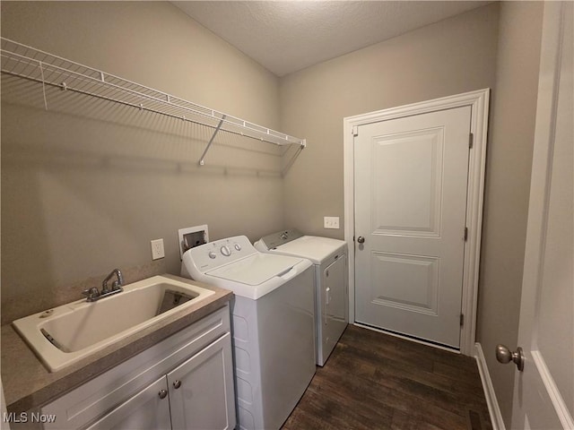 226 Hidden Glen Trl, Chardon, OH 44024 - washroom featuring washing machine and clothes dryer, cabinet space, and dark wood-style floors
