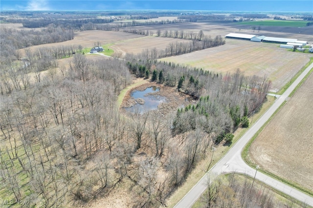 birds eye view of property with a rural view and a water view