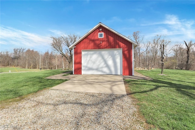 detached garage with concrete driveway