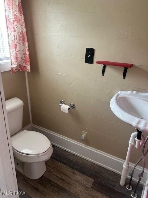 252 W Summit St, Alliance, OH 44601 - bathroom featuring toilet and wood finished floors