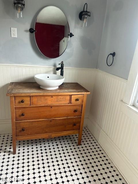 252 W Summit St, Alliance, OH 44601 - bathroom featuring wainscoting and vanity