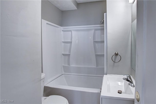 full bath with toilet, vanity, and shower / washtub combination