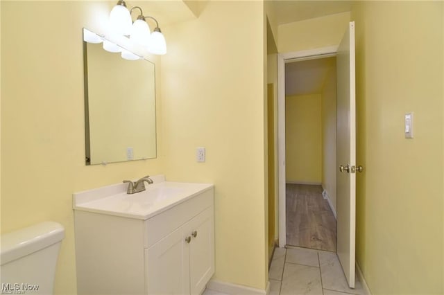 210 Magnolia Ave, Northfield, OH 44067 - half bath with marble finish floor, toilet, vanity, and baseboards