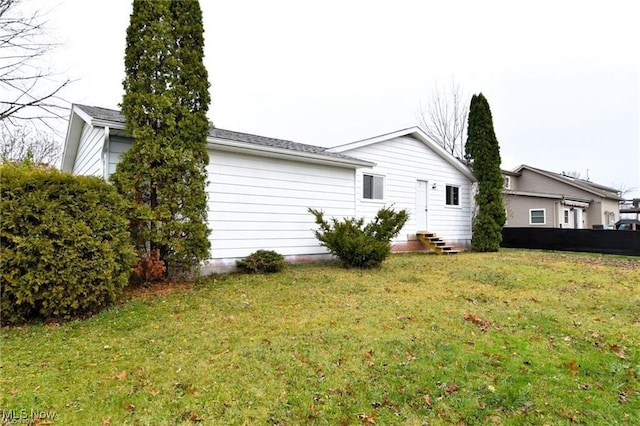 210 Magnolia Ave, Northfield, OH 44067 - view of property exterior with a lawn and entry steps