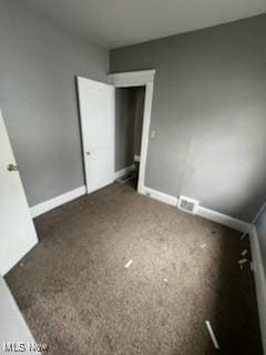 952 Whitby Rd, Cleveland Heights, OH 44112 - unfurnished bedroom featuring baseboards, visible vents, and carpet