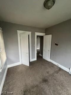 952 Whitby Rd, Cleveland Heights, OH 44112 - unfurnished bedroom featuring carpet and baseboards