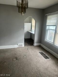 952 Whitby Rd, Cleveland Heights, OH 44112 - unfurnished room with carpet floors, arched walkways, baseboards, and visible vents