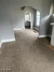 952 Whitby Rd, Cleveland Heights, OH 44112 - bonus room featuring arched walkways, carpet floors, baseboards, and a brick fireplace