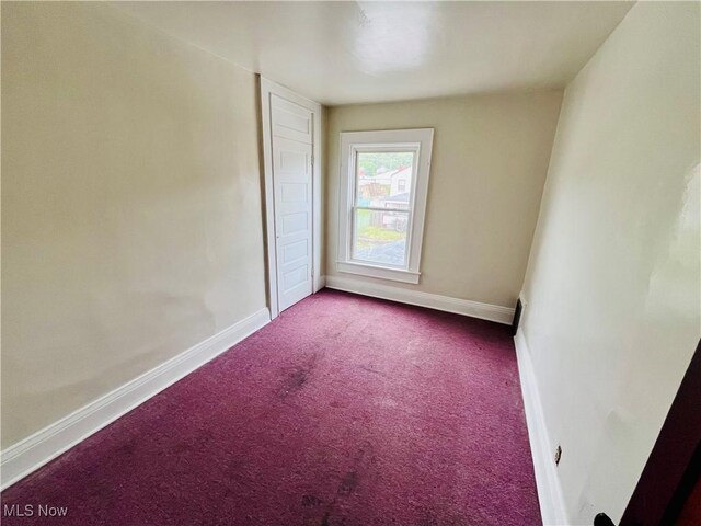 406 Grant St, Newell, WV 26050 - carpeted empty room with baseboards