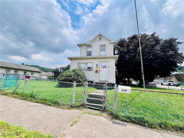 319 Grant St, Newell, WV 26050 - traditional-style home featuring a fenced front yard and a gate
