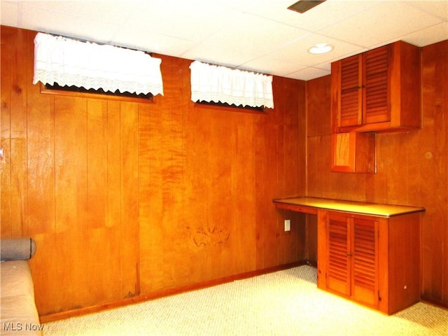 15613 Maplewood Ave, Maple Heights, OH 44137 - finished below grade area with a paneled ceiling, wood walls, and light carpet