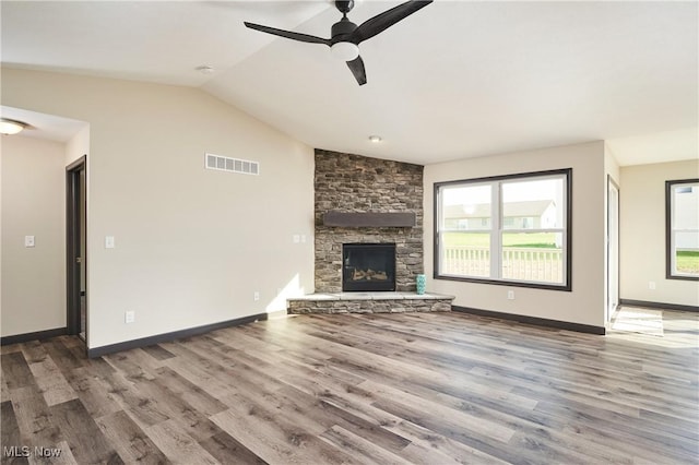 5058 Catawba Place Ln, Seville, OH 44273 - unfurnished living room featuring vaulted ceiling, baseboards, visible vents, a ceiling fan, and wood finished floors
