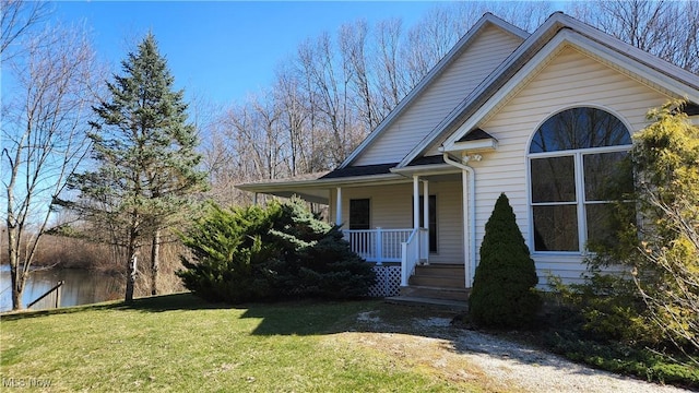 11466 Bloom Rd, Garrettsville, OH 44231 - view of front of home featuring a front yard, covered porch, and a water view