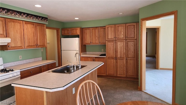 11466 Bloom Rd, Garrettsville, OH 44231 - kitchen with white appliances, range hood, a sink, brown cabinets, and light countertops
