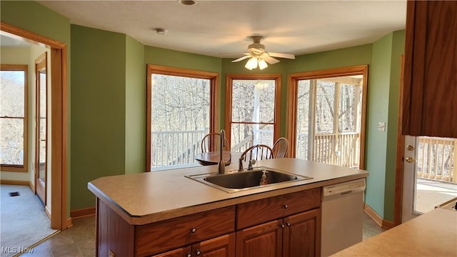 11466 Bloom Rd, Garrettsville, OH 44231 - kitchen featuring dishwasher, a sink, a ceiling fan, and plenty of natural light