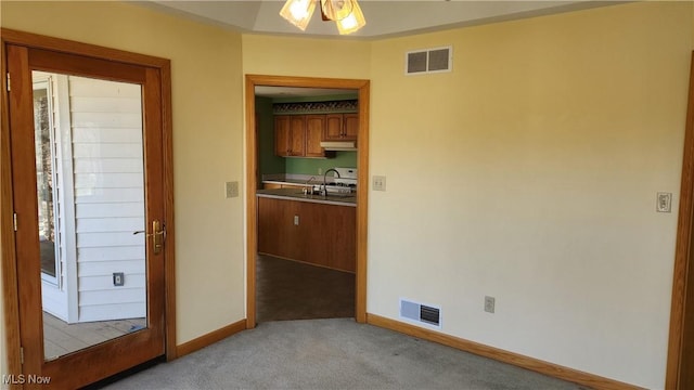 11466 Bloom Rd, Garrettsville, OH 44231 - unfurnished room with light carpet, baseboards, a sink, and ceiling fan