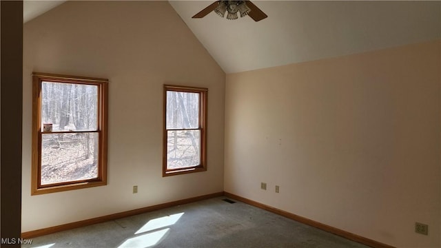 11466 Bloom Rd, Garrettsville, OH 44231 - empty room with plenty of natural light, a ceiling fan, baseboards, light colored carpet, and high vaulted ceiling