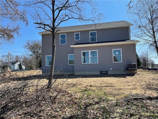 back of property featuring central AC