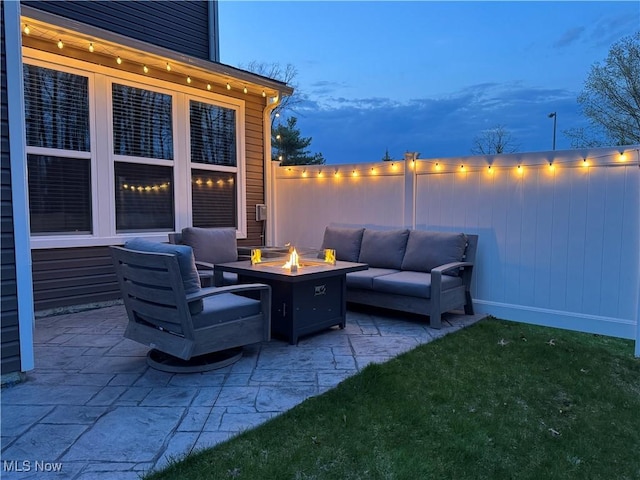 view of patio / terrace featuring an outdoor living space with a fire pit