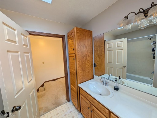 full bath with shower / bathing tub combination, tile patterned floors, and vanity