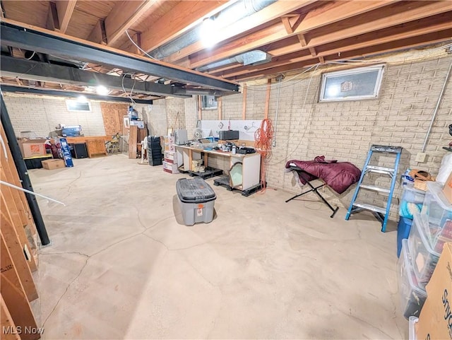 unfinished basement with brick wall