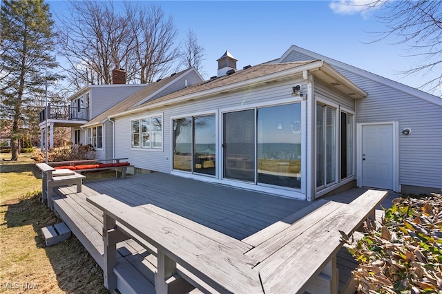 1122 Lake Rd, Conneaut, OH 44030 - rear view of house with a chimney and a deck