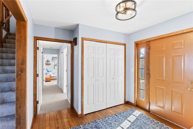1122 Lake Rd, Conneaut, OH 44030 - foyer featuring hardwood / wood-style floors, plenty of natural light, baseboards, and stairway