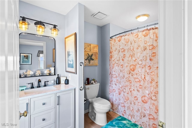 1122 Lake Rd, Conneaut, OH 44030 - bathroom with visible vents, a shower with shower curtain, toilet, wood finished floors, and vanity