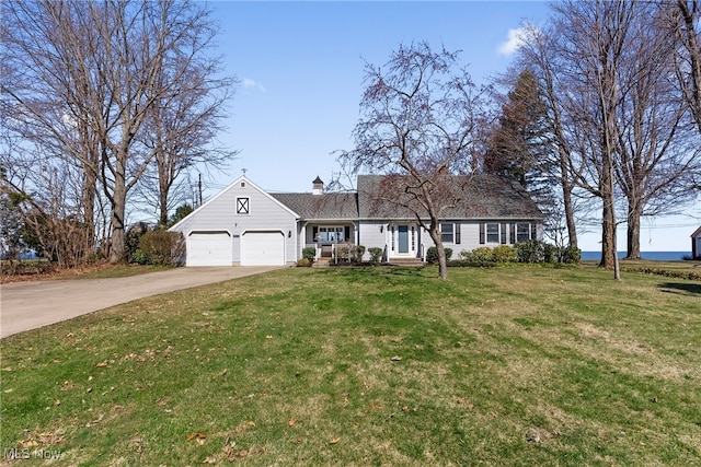 1122 Lake Rd, Conneaut, OH 44030 - view of front facade featuring a chimney, a garage, a front lawn, and concrete driveway