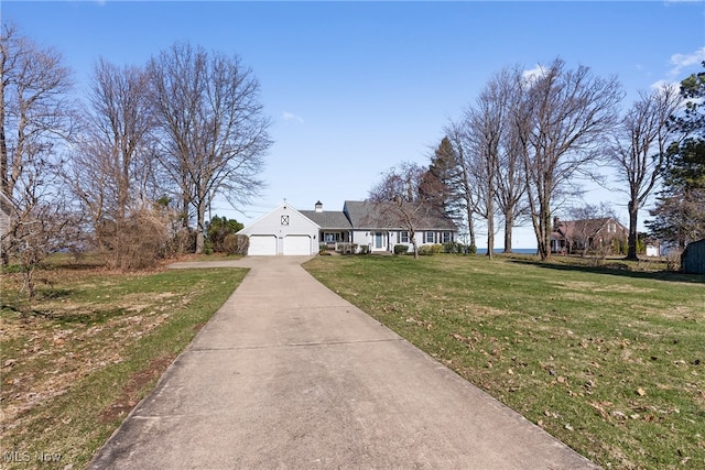 1122 Lake Rd, Conneaut, OH 44030 - view of front of property featuring a front yard, driveway, and a garage