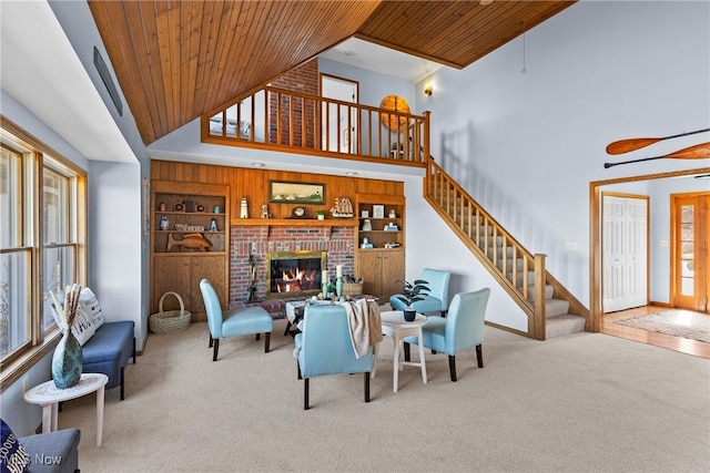 1122 Lake Rd, Conneaut, OH 44030 - carpeted living room with wooden ceiling, built in features, and stairway