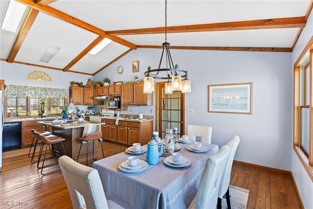 1122 Lake Rd, Conneaut, OH 44030 - dining area featuring lofted ceiling with beams, a notable chandelier, dark wood-type flooring, and baseboards