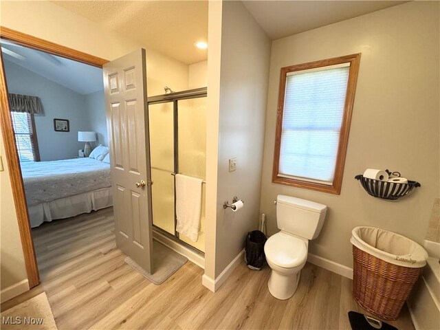 33 Mallards Xing, Canfield, OH 44406 - full bathroom featuring a stall shower, a healthy amount of sunlight, and wood finished floors
