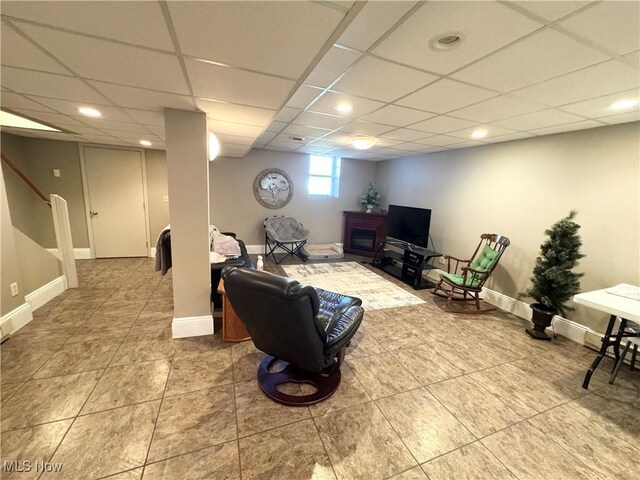 33 Mallards Xing, Canfield, OH 44406 - tiled living area featuring baseboards and a paneled ceiling