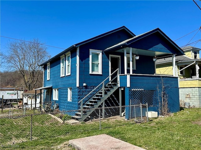 87R 26th St, Wellsburg, WV 26070 - view of front facade with stairs, fence, a front lawn, and a porch