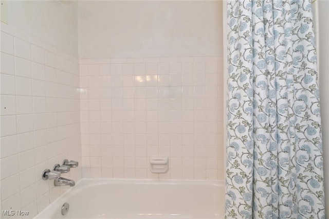 full bath featuring shower / bath combination with curtain