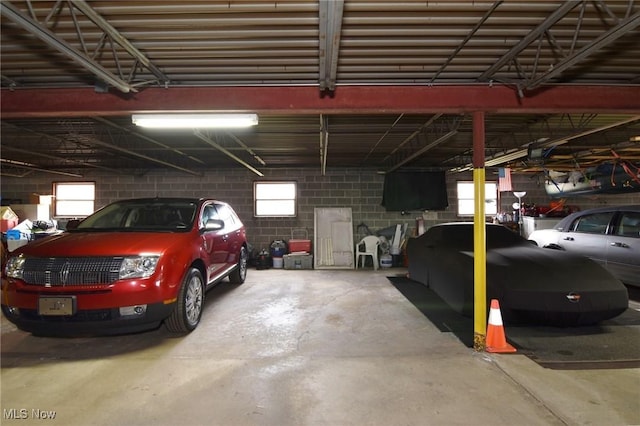 garage with concrete block wall