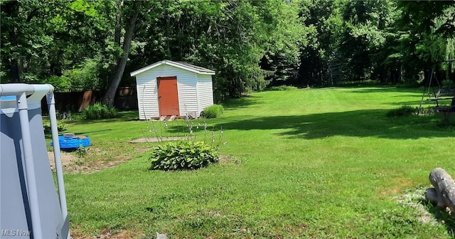 278 W Main St, Andover, OH 44003 - view of green lawn featuring a shed