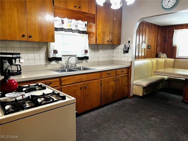1275 Hollywood, Warren, OH 44483 - kitchen with a sink, light countertops, tasteful backsplash, and brown cabinetry